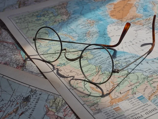 7th Era North Borders: Round spectacles sitting on top of a world map