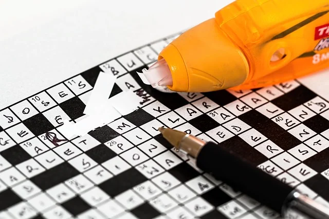 Correction tape fixing a mistake on a crossword puzzle