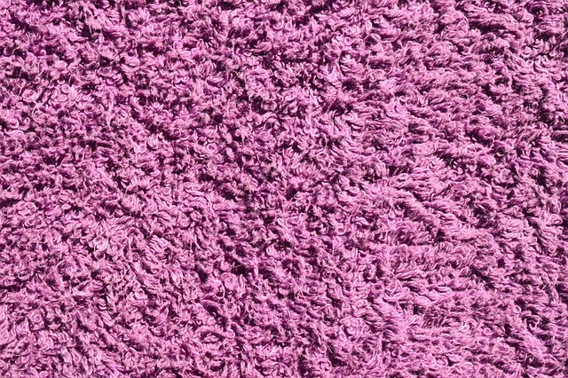 Close-up texture of purple terry cloth fabric