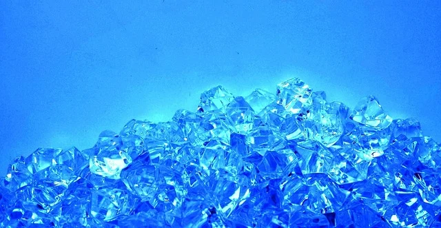A pile of glowing light blue crystals or gemstones