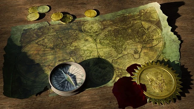 An old world map with gold coins, compass, and medallion