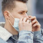 man wearing black tall t-shirt