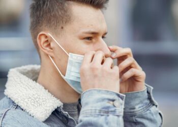 man wearing black tall t-shirt