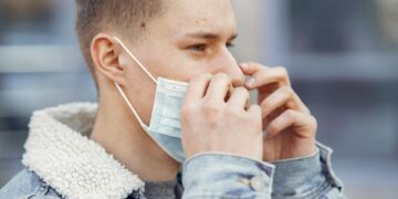 man wearing black tall t-shirt
