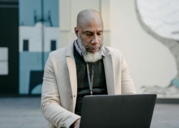 man working in warehouse then in office