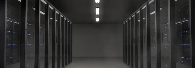 Rows of server racks inside a data center or server room