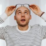 person looking stressed at desk