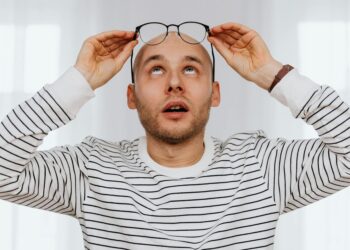 person looking stressed at desk
