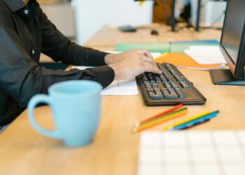 person working on laptop beach