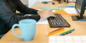 person working on laptop beach