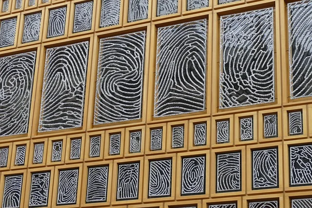 Ryan De Gennaro The Untold Truth Behind Building A Brand Privacy Clo: A building facade featuring panels decorated with finge