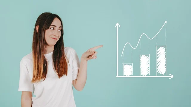 A woman pointing towards a drawn performance growth graph