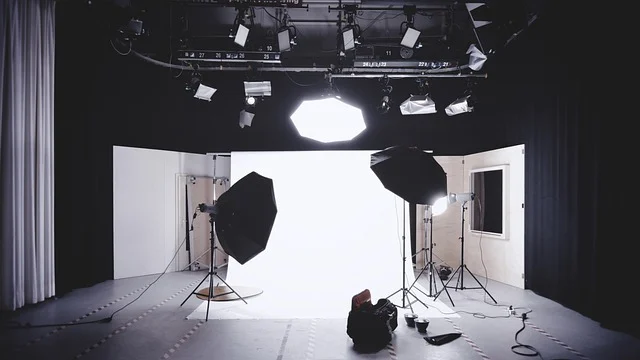 UnityAHFront 360x.jpg: A professional photography studio set with studio lights and white backdrop