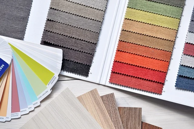 Fabric swatches, color palettes, and wood samples for interior design