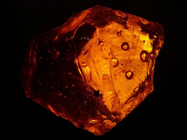 Stones gems and their meanings: A rough piece of translucent amber gemstone