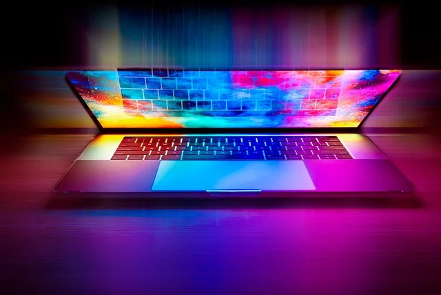 An open laptop with colorful vibrant lighting effects