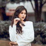 woman styling white top