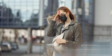 woman wearing beige dress