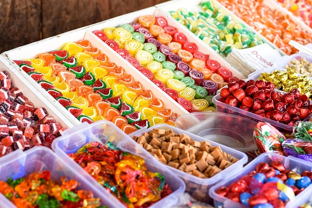 Assortment of colorful beads, metal findings, and spools of jewelry wire
