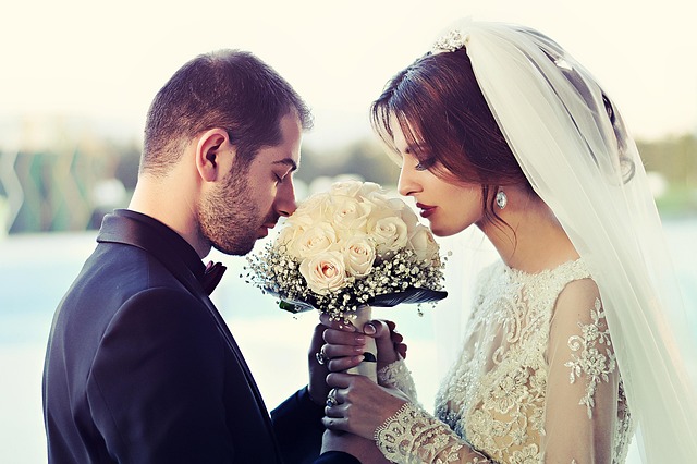 Bride in a modern long sleeve wedding dress with clean lines and a high neckline (long sleeve wedding dresses)