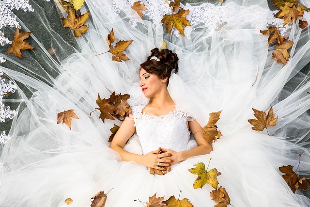 Bride showing off the detailed sleeves of her wedding dress