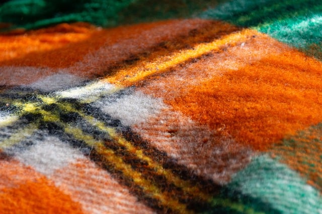 Close-up of a cable knit sweater showing the intricate stitch pattern
