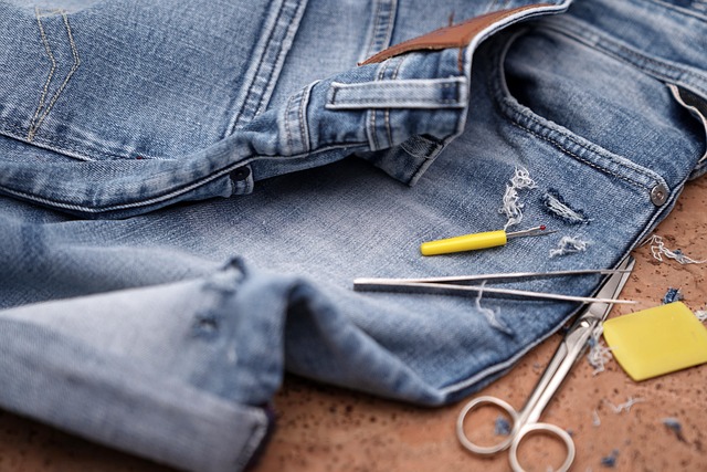 Close-up of denim fabric with subtle distressing and fraying