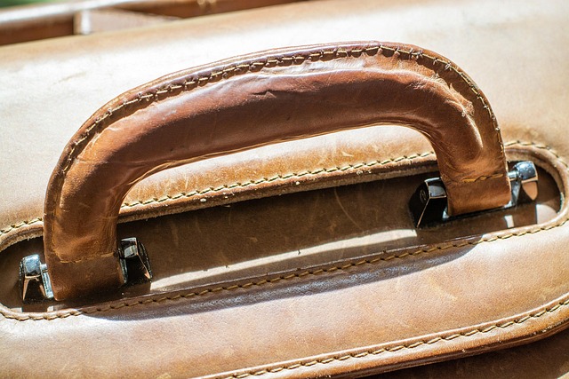 Close-up of a distressed leather Rick Owens low top sneaker, highlighting texture and stitching.