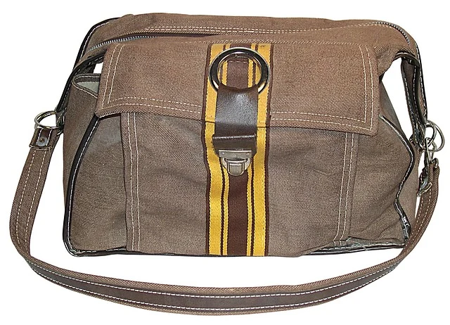 A brown canvas shoulder bag with stripe detail