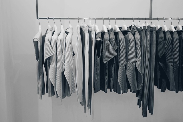 Pleated clothing hanging on a rack in a retail store