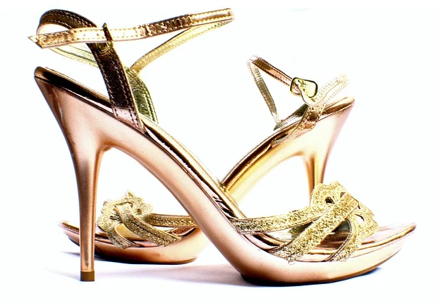 A pair of gold metallic strappy high heels