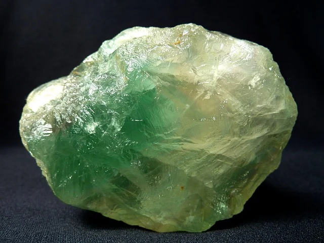A raw green crystal gemstone
