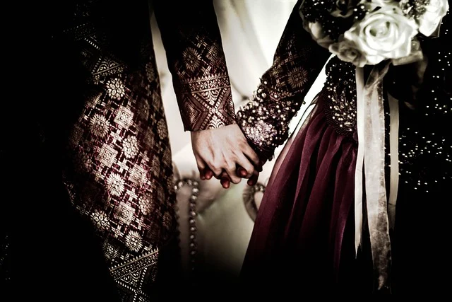 How to Style Streetwear for Formal Events: A couple holding hands in ornate traditional formal attire