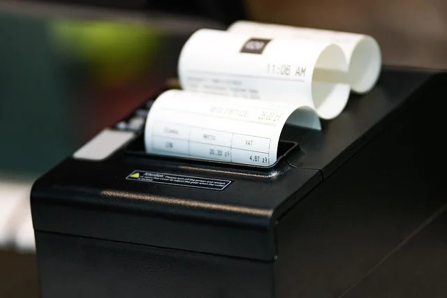 A thermal receipt printer printing a store receipt