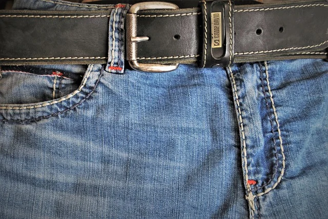 How should you style baggy jeans to balance proportions?