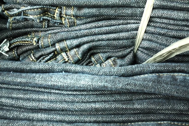 A stack of folded blue denim jeans