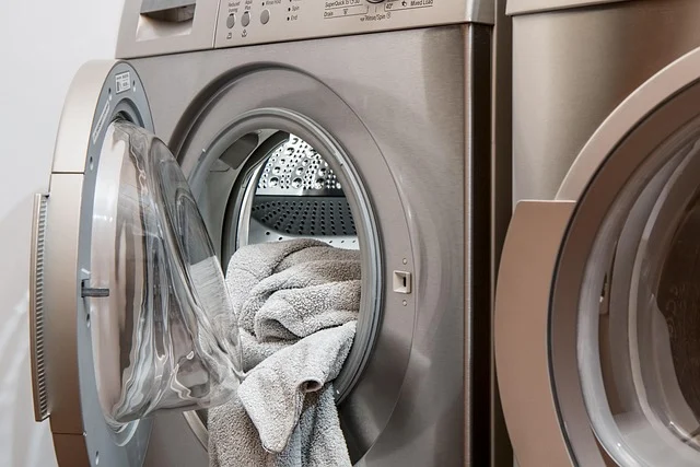 A front-loading washing machine with towels inside