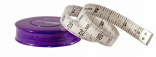 A retractable measuring tape on a white background