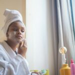 person applying face serum