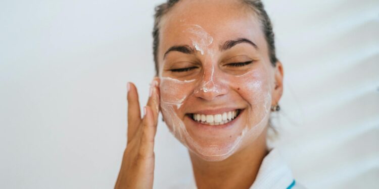 person applying gentle cleanser