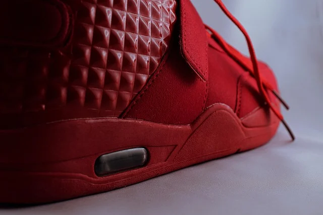 Close up of a red sneaker heel showing the air bubble unit