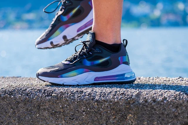 A person wearing Nike Air Max sneakers outdoors