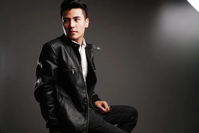 A man wearing a stylish black leather jacket