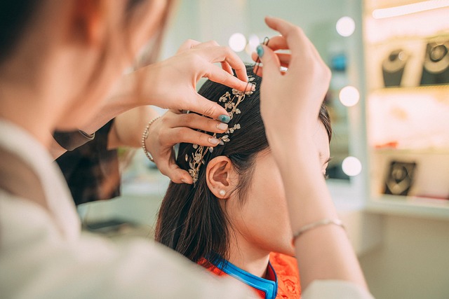 Stylist demonstrating how to use a round brush on curtain bangs