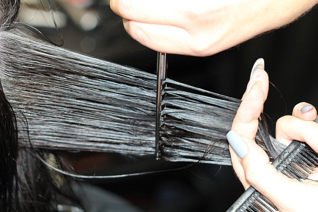 Stylist trimming a basin haircut