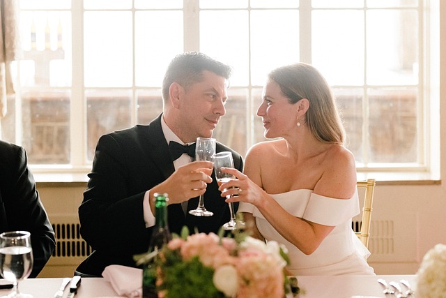 Wedding reception scene with focus on a bride's feet in silver heels standing on a dance floor.