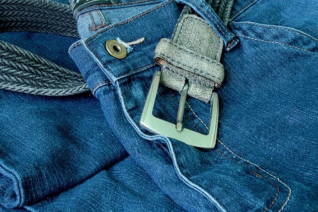 Close-up of a belt on blue jeans