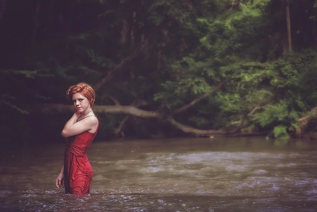Best amazon dresses under $40: Woman in a red dress standing in a river