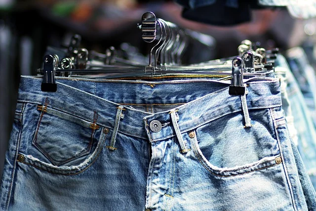Jeans hanging on a rack in a retail store