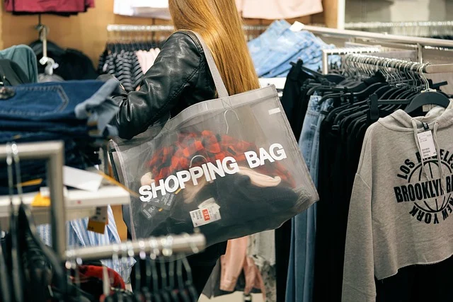 A woman shopping inside a retail clothing store